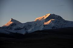 
Phola Gangchen (7661m) and Shishapangma East Face shine at sunrise from Shishapangma North Base Camp (5029m).
